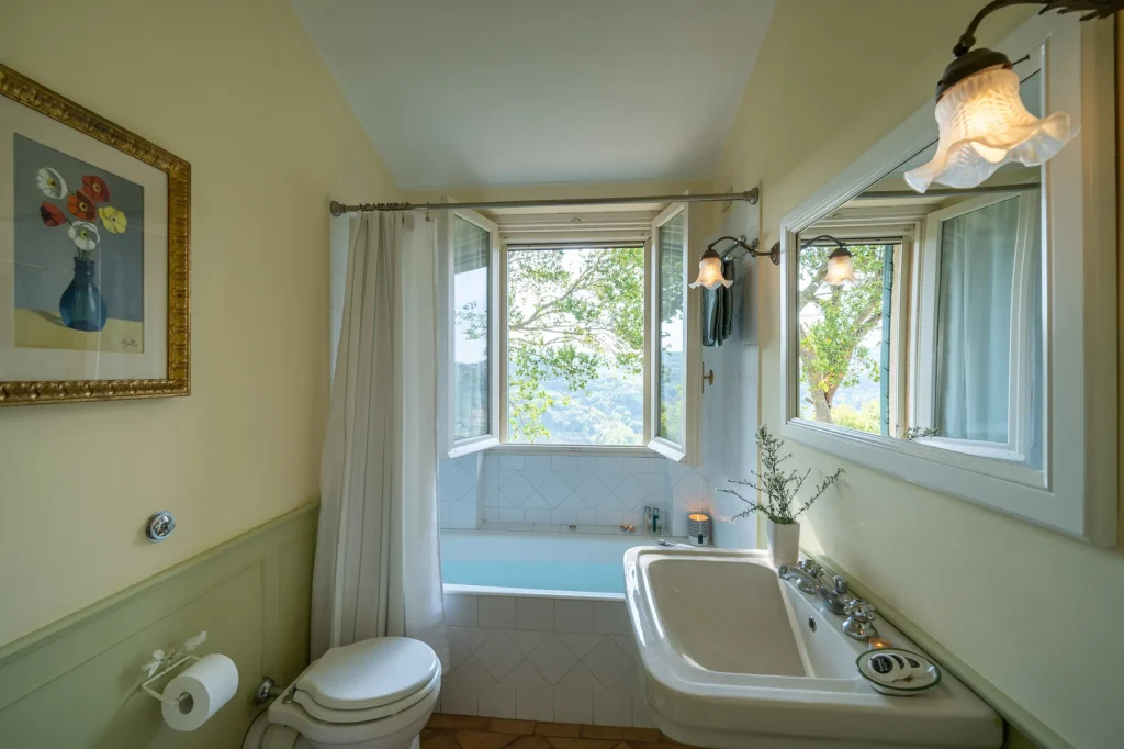A bathroom finished in local stone