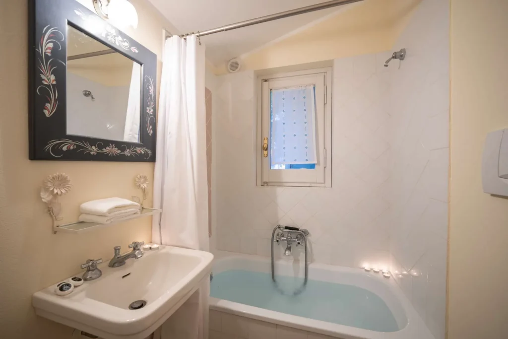 One of the villa's bathrooms, finished in stone and brass