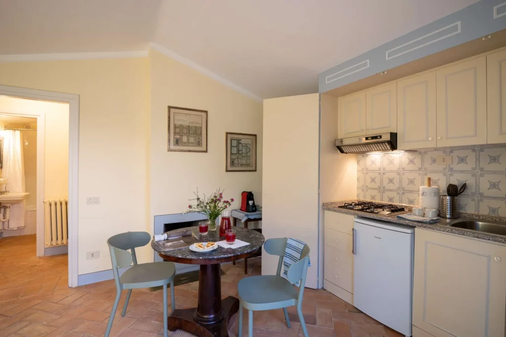 The guest house bedroom with its own kitchenette nearby