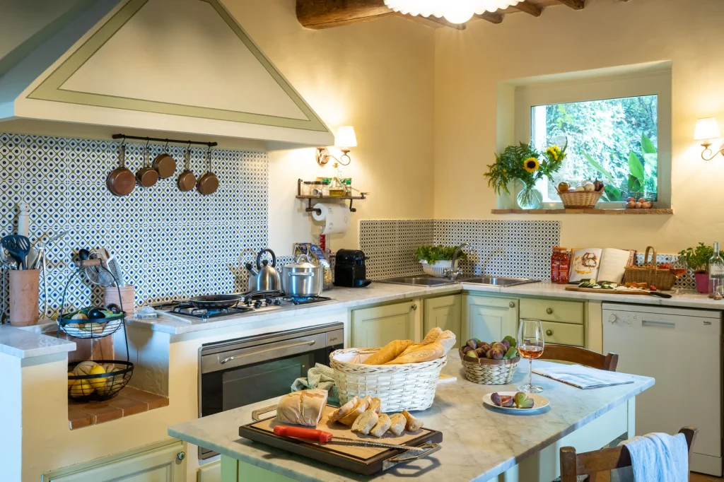 The country kitchen with its long wood table set for twelve