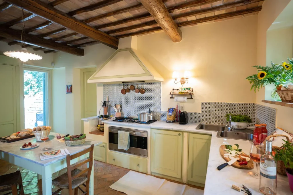 The long kitchen table set for a meal
