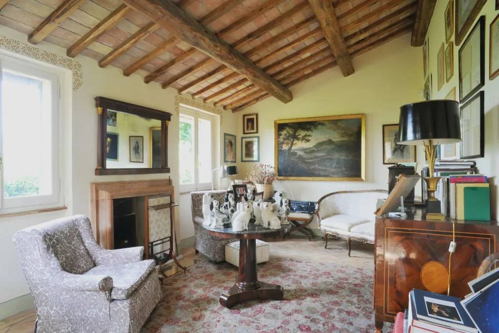 The main sitting room with beamed ceilings and terracotta floors
