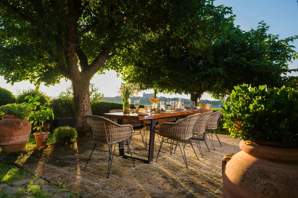 Dinner under the pergola The pergola table set for dinner as the light goes