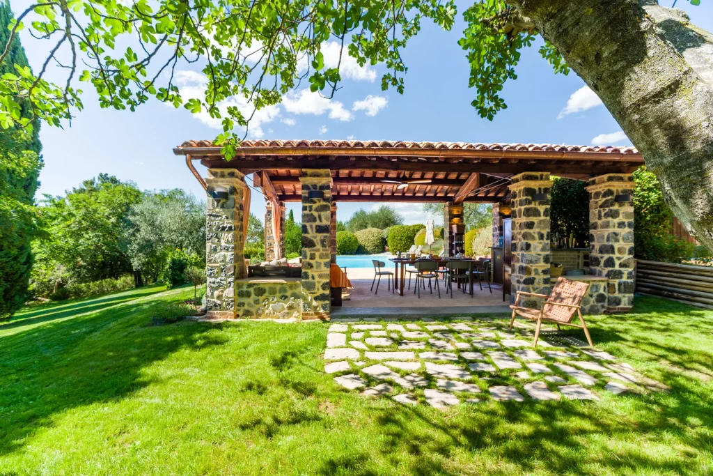 The poolside pergola The shaded pergola beside the pool, set for lounging and dining